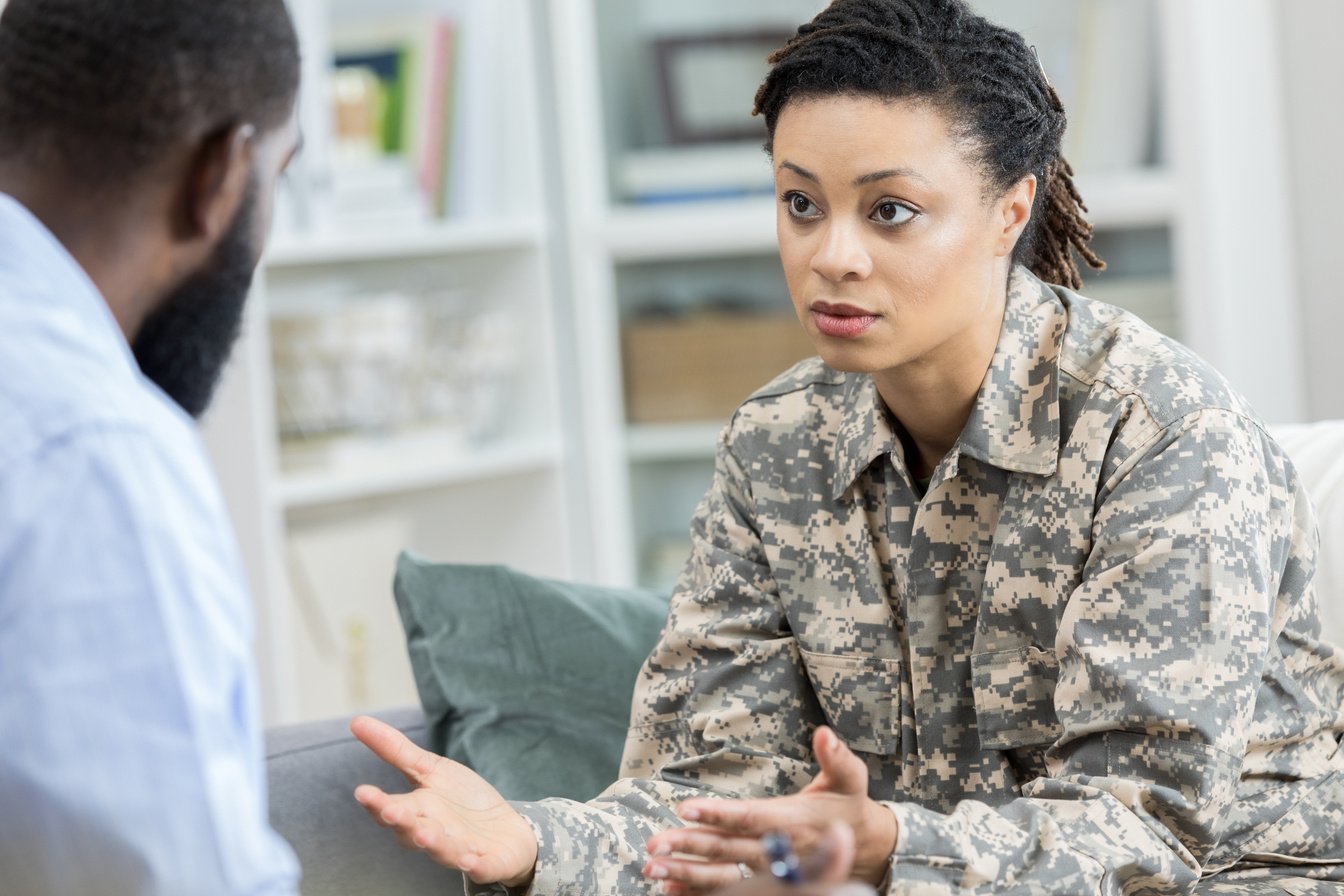 Army veteran with PTSD talks with therapist